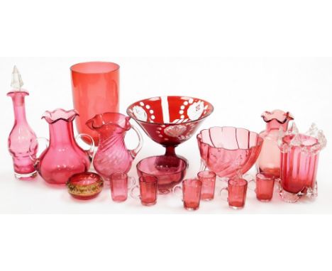 A group of 19thC and later cranberry coloured glass, to include a twin handled vase with a waved rim, 13cm high, various mini