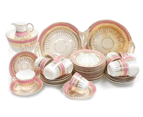 A late 19thC Staffordshire porcelain tea service, decorated in pink and gilt, comprising a pair of bread plates, cream jug, s