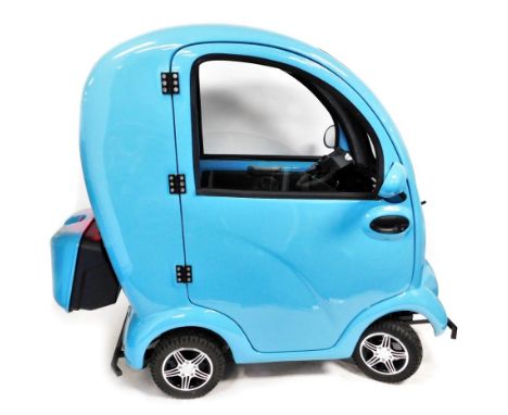 A Scooterpac cabin car MK2+, in blue trim, serial number 201909111, 2.8 registered miles, together with keys, electric chargi