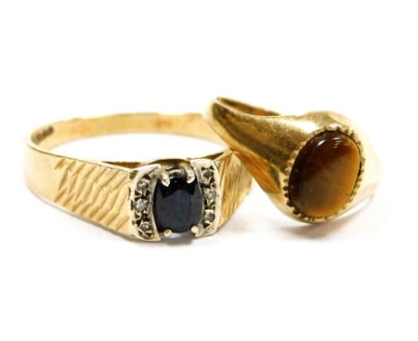 A 9ct gold sapphire and diamond ring, in a high setting with engraved shoulders, size V, together with a 9ct gold and tiger's