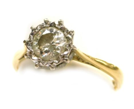 A diamond solitaire ring, in a high claw illusion setting, set in yellow metal, diamond approximately 0.7ct, size K, 2.9g.