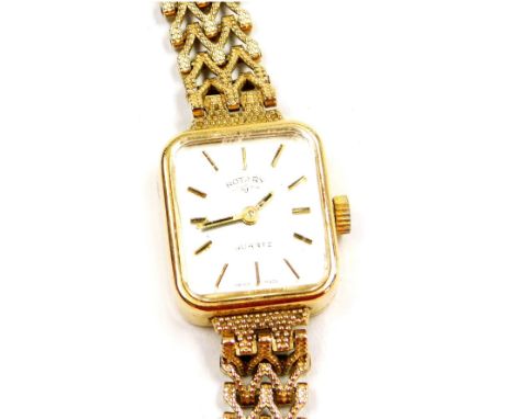 A Rotary 9ct gold lady's wristwatch, rectangular silvered dial, gold batons, quartz movement, on a gold strap, 13.0g all in.