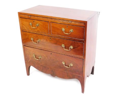 A George III mahogany and cross banded bachelors chest, the top with a brushing slide, above two short and two long drawers, 