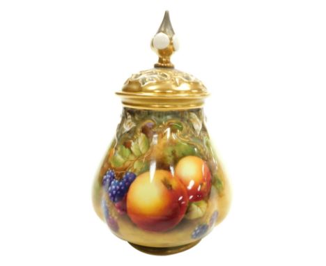 A Royal Worcester porcelain vase and pierced cover, circa 1951, the body painted with fruit, signed J Smith, gilt heightened,