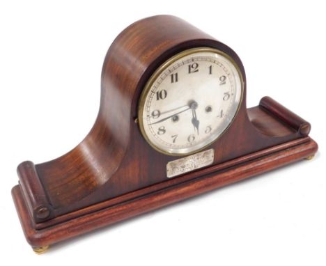 An early 20thC mahogany cased Napoleon hat mantel clock, silvered dial bearing Arabic numerals, German eight day movement wit