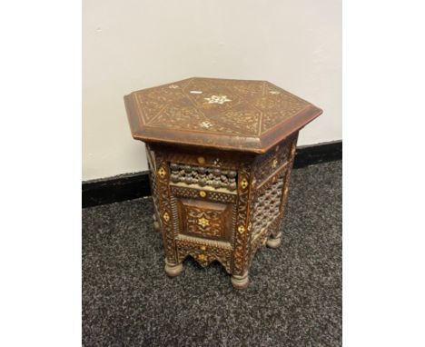 An Antique Indian carved hexagonal side table, styled with mother of pearl inlays. [40x36x36cm] 