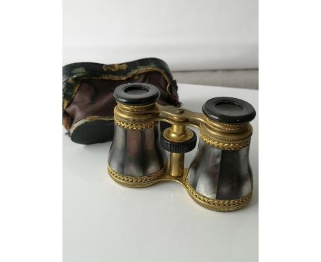A Pair of of black mother of pearl sectioned opera glasses, produced by Lennie Optician, princess st Edinburgh. Comes with a 