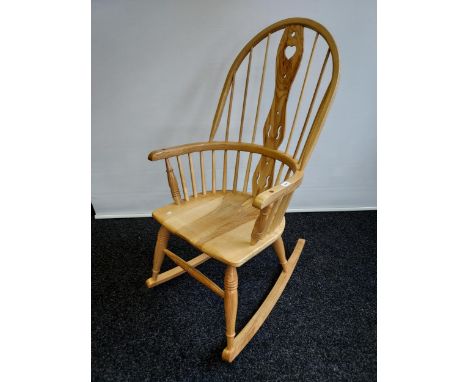 A Bespoke hand made light wood Windsor design rocking chair. 
