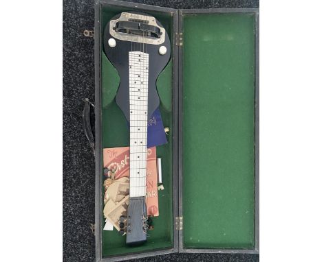 An Unusual Vintage small electric guitar with a fitted travel carry case. 