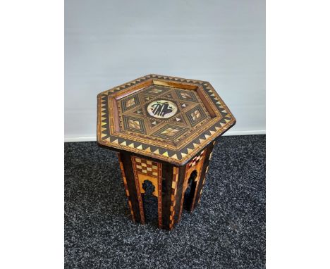 A Liberty &amp; Co design Arabic Hexagonal side table, designed with mother of pearl inlays. [44cm in height] [Repaired to on