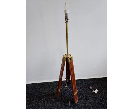A Contemporary wood and brass tripod floor lamp. [In a working order] 