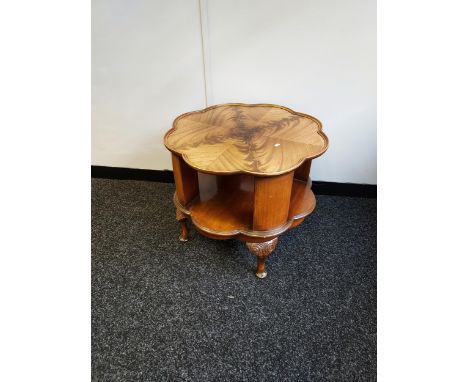 A Vintage mahogany revolving side table, designed with a pie crust edge top and queen anne legs. 