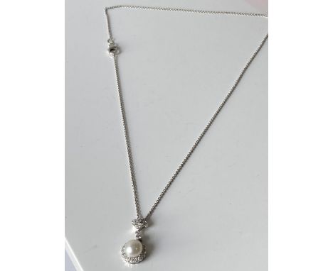An 18ct white gold diamond cluster &amp; single pearl pendant with an 18ct gold necklace [length 38cm] [3.55g] 