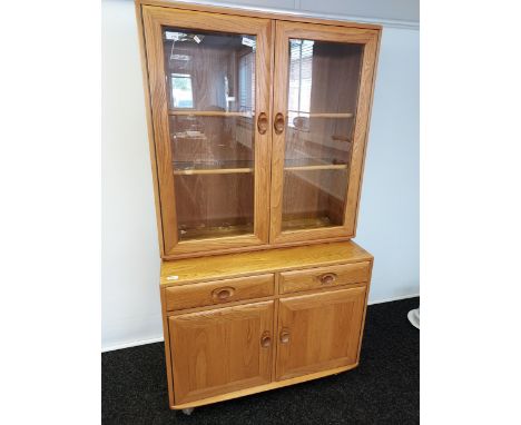 An Ercol light elm wood display cabinet [162x90x45cm] 