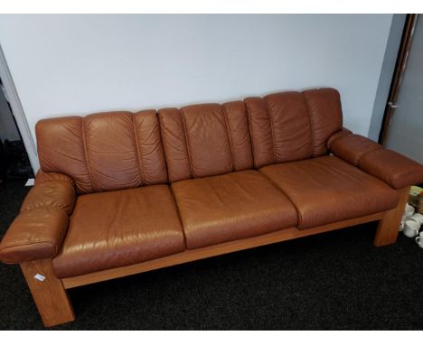 A 1960's mid century Ekornes three seat sofa. Designed with teak wooden frame and brown leather upholstery. [Very comfortable