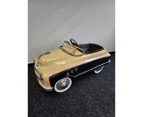 A Vintage Buick Torpedo pedal car.