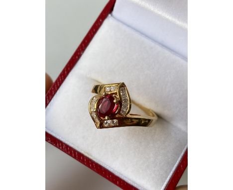 An 18ct gold ladies diamond &amp; ruby set ring [size M] [4.13g] 