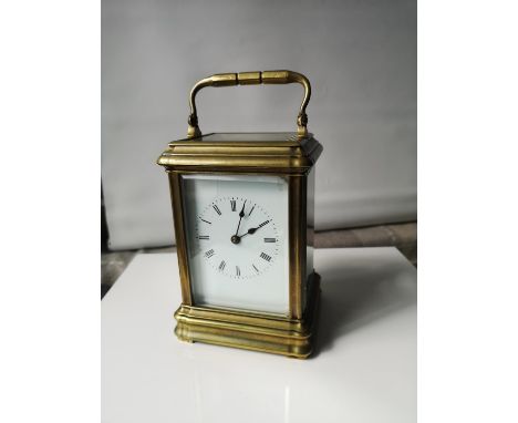 An antique heavy brass and glass carriage clock. In a working condition. [15x10x9cm] 