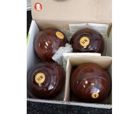 A Lot of four vintage wooden bowling bowls. Inlaid with initials MH. 