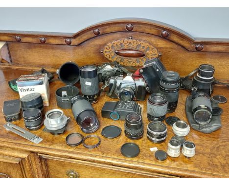 A Collection of vintage cameras and lenses to include Soligor 50mm lens, Hanimex zoom lens, Carl Zeiss Jena Prakticar 1:24, C