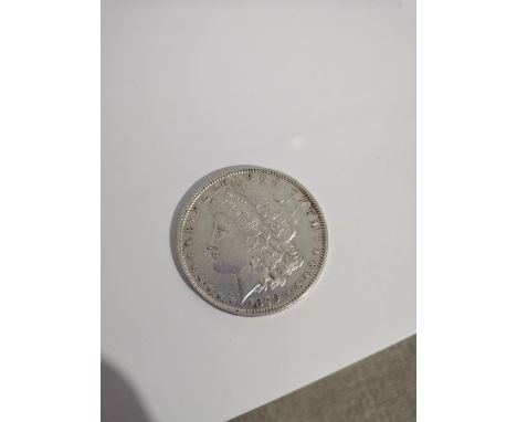 A SILVER 1879 ONE DOLLAR COIN. 