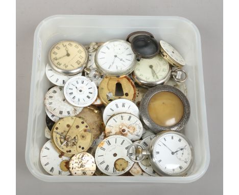 A box of pocket watch movements, dial and cases.