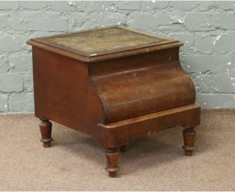 A Victorian commode on turned supports.