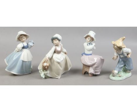 Four Nao figures of children.