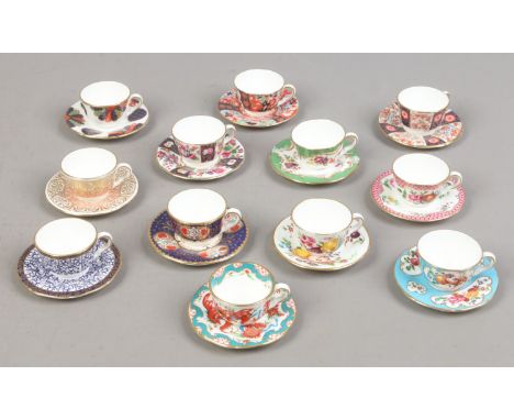Twelve miniature Royal Worcester cup and saucers, all replicas of 18th century examples Condition Report. To be used as a gui