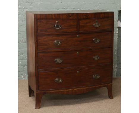 A Georgian mahogany bow front chest of drawers on bracket feet.