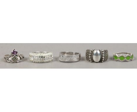 Five silver dress rings including crystal enamel and stone set examples.