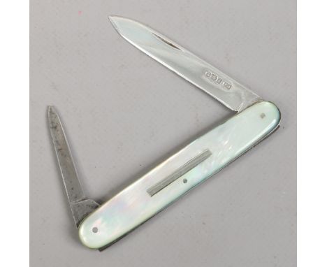 A Victorian silver and steel two blade folding pocket knife with mother of pearl scales, maker T. Harrop. Assayed Sheffield 1