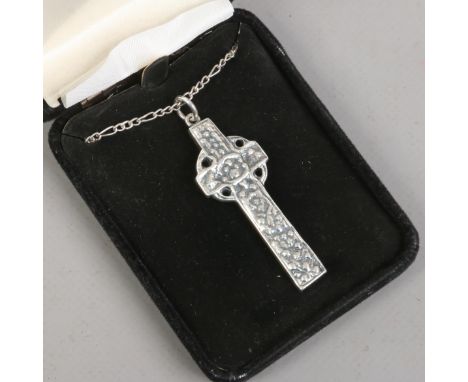 A large silver pendant formed as a Celtic cross and supported on a chain. 