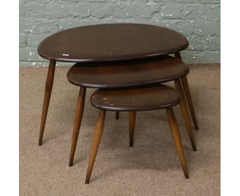 An Ercol nest of three pebble tables.