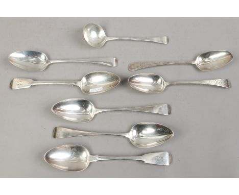 Seven silver tablespoons and a silver ladle. Including a pair of fiddle pattern spoons, assayed London 1925, 454 grams.