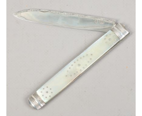 A Georgian silver folding fruit knife with engraved blade and having mother of pearl scales with piquet inlay. Partial hallma