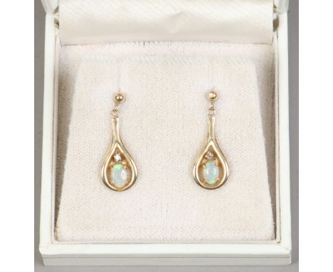 A pair of 9ct gold opal and diamond drop earrings. 