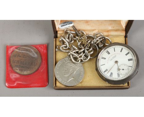 A Victorian silver pocket watch assayed Chester 1897 on silver chain, along with a World War II medal and a Centenary of the 