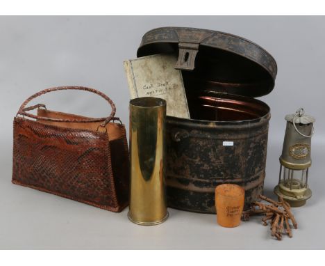 A military tin hat box, snakeskin handbag, brass shell case, miners lamp, 19th century cash book and a 1931 Worksop Charter D