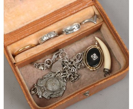 A small collection of mixed jewellery including silver dress rings, bracelets and a swimming model etc.