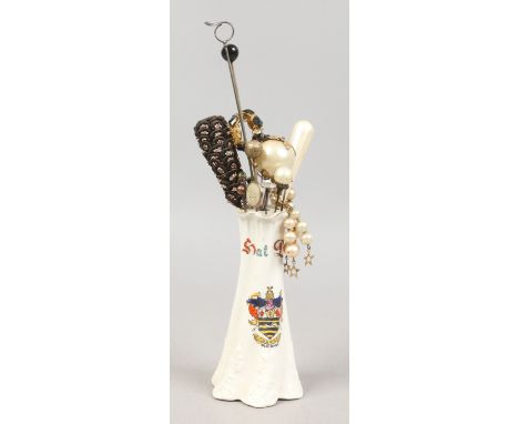 A crested china hat pin holder and collection of vintage hat pins including simulated pearl examples. 