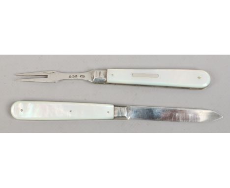 An Edwardian conjoined two piece silver folding knife and fork set with mother of pearl scales by William Needham. Assayed Sh