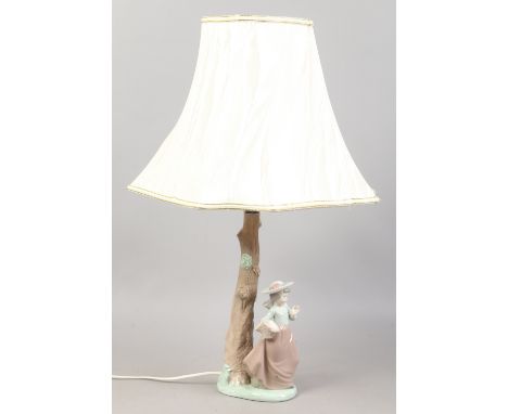 A Nao tablelamp of a girl under a tree.