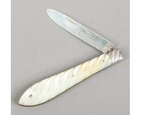 A Victorian silver folding fruit knife by Edmund Bell. With wrythen carved mother of pearl scales. Assayed Sheffield 1893.