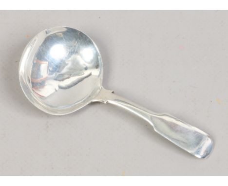 A George IV silver fiddle pattern caddy spoon, assayed London 1824, maker J.D.