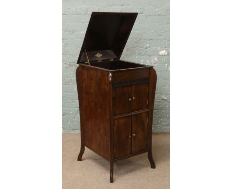 An Edwardian carved oak gramophone cabinet. Mechanism removed.