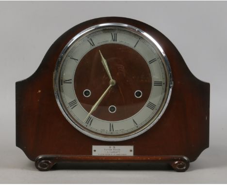 A mahogany mantle clock with Westminster chime.