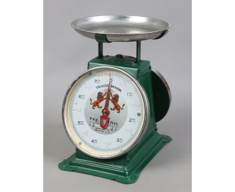 A set of painted trade mark shop scales with two dials.