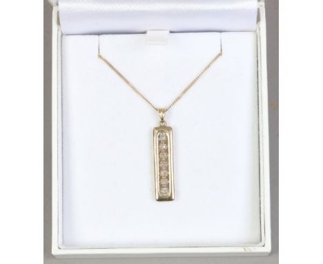 A 9ct gold and diamond pendant on chain set with 7 stones. 