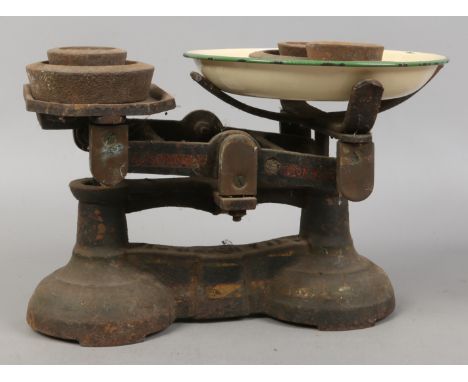A set of J & J Siddons Limited weighing scales along with a quantity of avery weights.